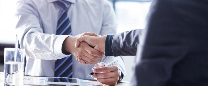 Business handshake in the office