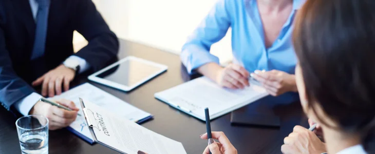 Professionals meeting with a client